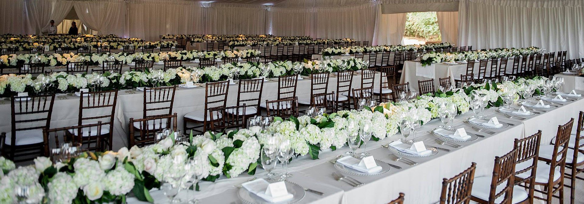 Interior banquet table setting inside event tents in Nashville.